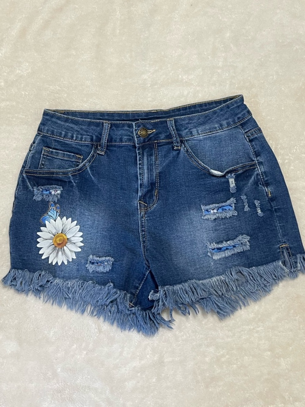Women's Y2K Blue Denim Daisy Shorts with frayed hem